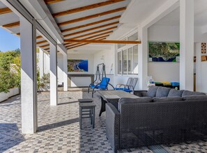 An outdoor patio area with a table, chairs, and a sofa. - One bedroom apartment with Sea view and Terrace (5) (Podgora)