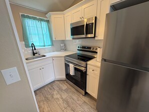 Private kitchen - 🌅 Connecting Poolside Studios | Sleeps 4 (Treasure Island)