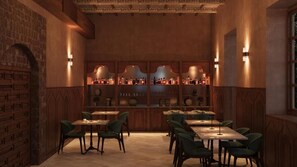 A restaurant interior with brick walls, wooden paneling, and a bar area with shelves of bottles. - Aria Santa María (Santo Domingo)