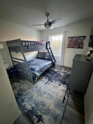 A room with bunk beds, a desk, a ceiling fan, and a window with blinds. - 3 BD/ 2.5 BA/ Terra Verde (4709 FB) (Kissimmee)