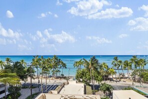 A beachfront view with palm trees and a clear sky. - ~NEW~ Modern Oceanfront at Waikiki Beach Tower (Honolulu)
