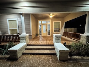 A wooden deck with stone steps leading to a glass door entrance. - Casa 746 Fort Worth Downtown Stockyards Retreat (Fort Worth)