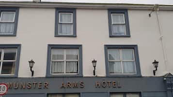 A building with a sign reading 'Munster Arms Hotel'.