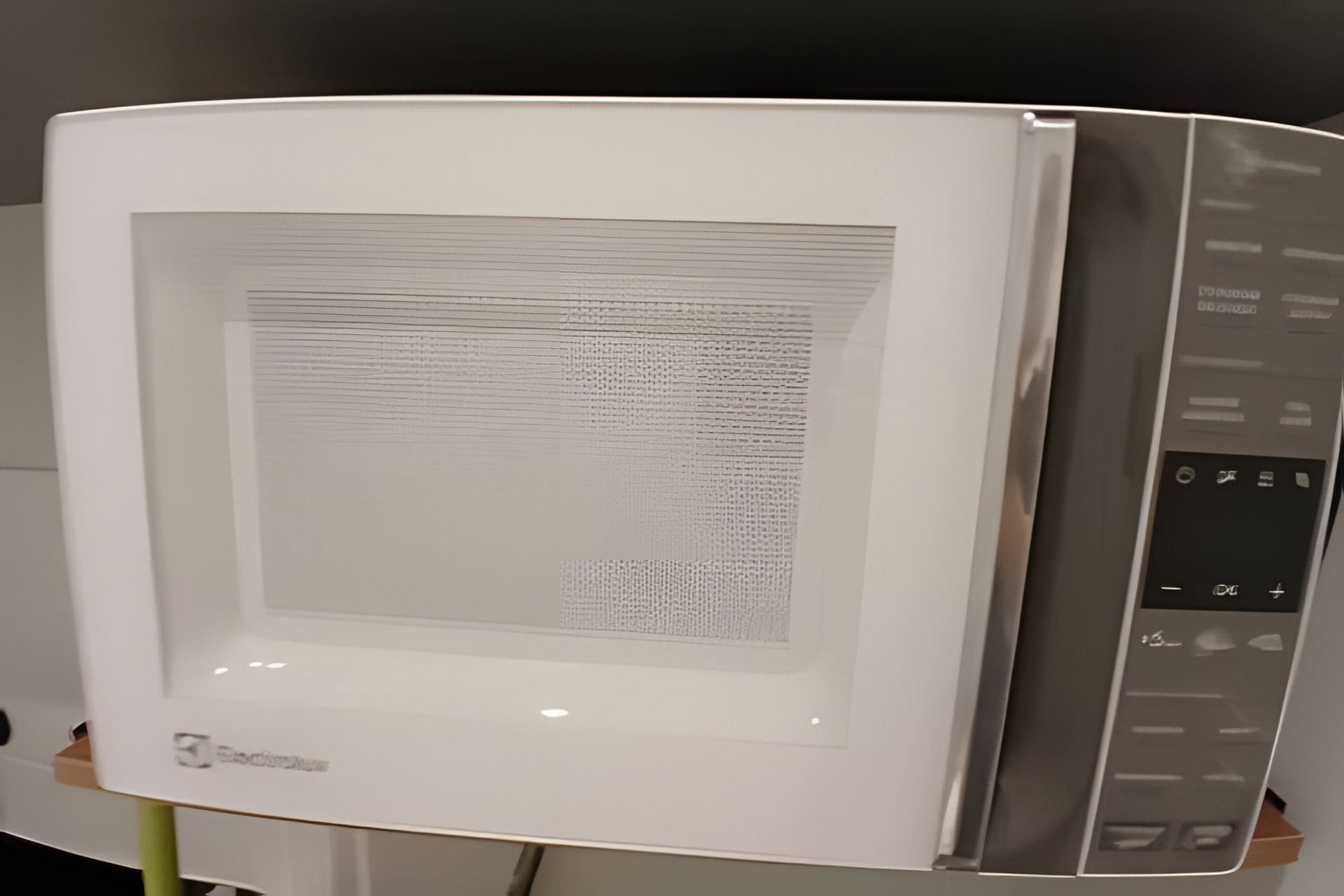 A flat-screen television with a visible text display on the screen.