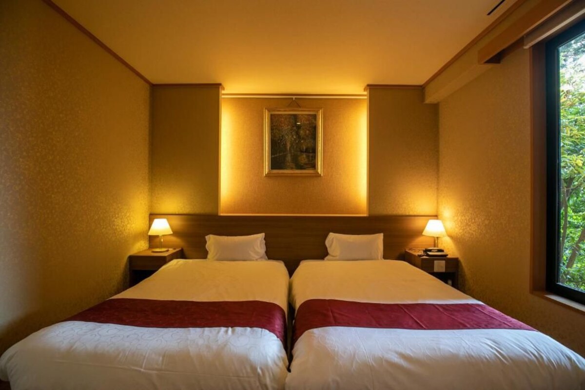 Suíte premium, sacada, vista para o jardim | Cofres nos quartos, Wi-Fi de cortesia