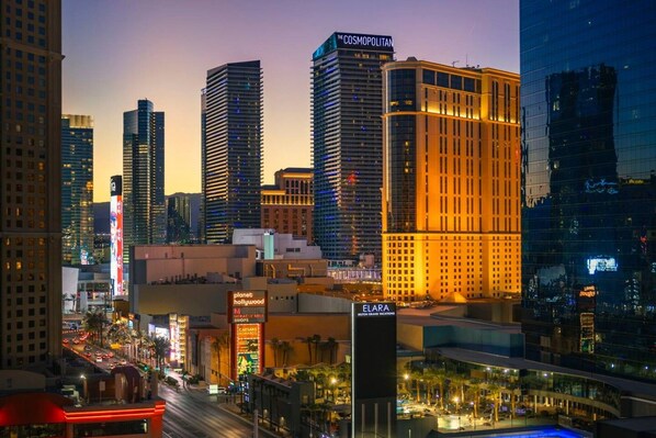 A cityscape with high-rise buildings, including a hotel with a visible sign.