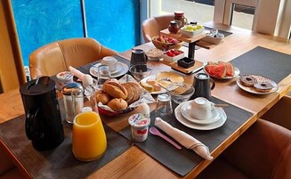 A breakfast buffet with various food items and beverages.