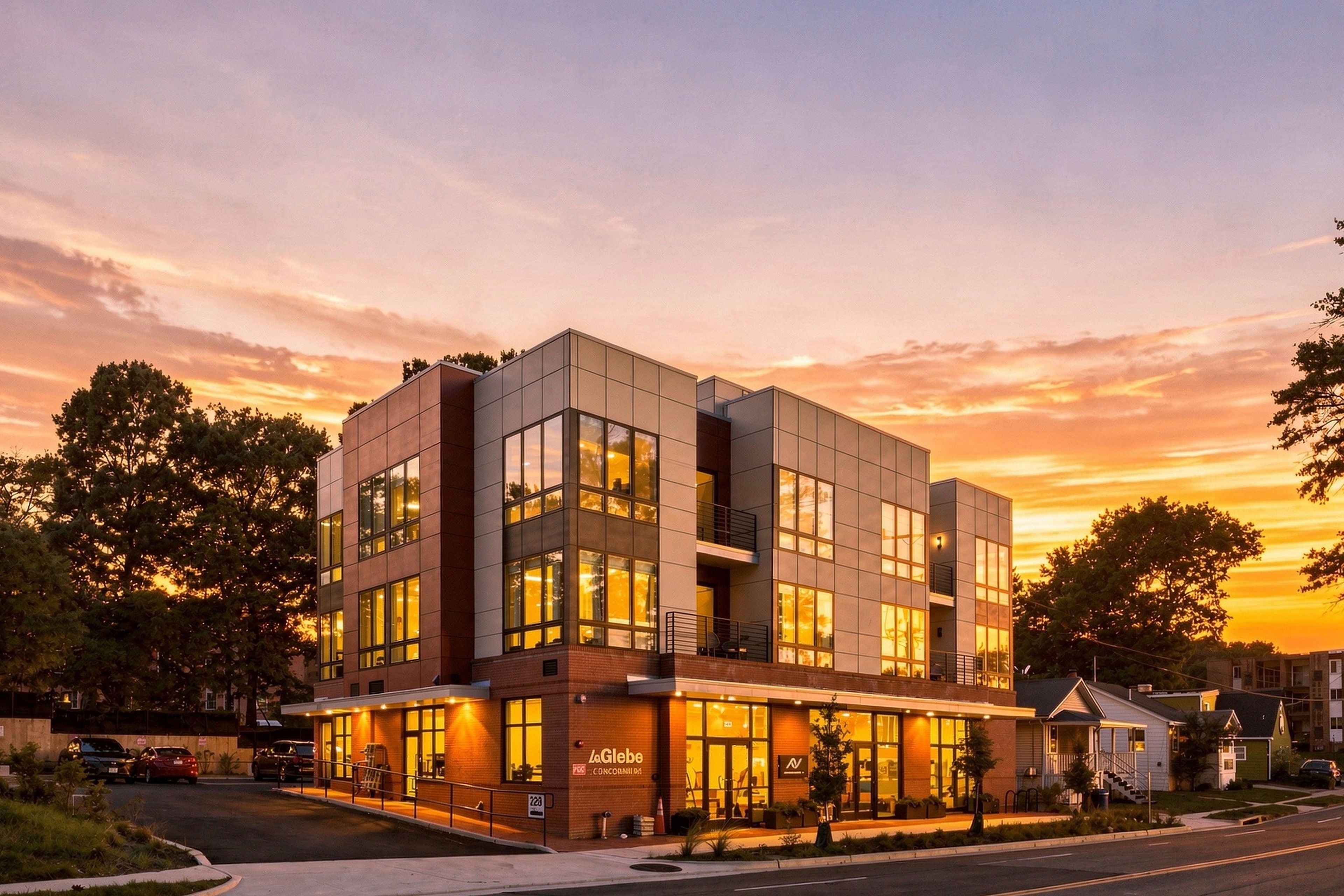 A multi-story hotel with a modern architectural design, featuring large windows and a ground-level restaurant.