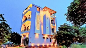 A multi-story building with balconies and a flat roof. - Asapian House by Shrigo Hotels (Moradabad)