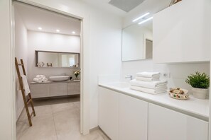 A modern bathroom with a large mirror, a vessel sink, and a countertop with towels and toiletries. - Villa Venere With Garden & Parking, Ceriale, Italy (Ceriale)