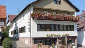 A two-story building with a sign reading 'GASTHOF LAMM'.
