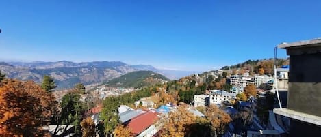 A mountainous landscape with buildings and trees.