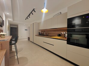 Appartamento, balcone, vista città | Cucina privata
