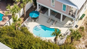 A residential property with a swimming pool, outdoor furniture, and a covered patio area. - ☀️ Seas the Day | Ocean Views | Steps 2 Beach | Private Pool | Free Golf (Miramar Beach)