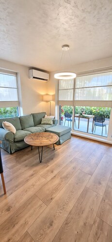 Stylish Apartment with Large Green Terrace & Private Parking