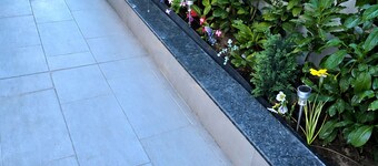 Stylish Apartment with Large Green Terrace & Private Parking