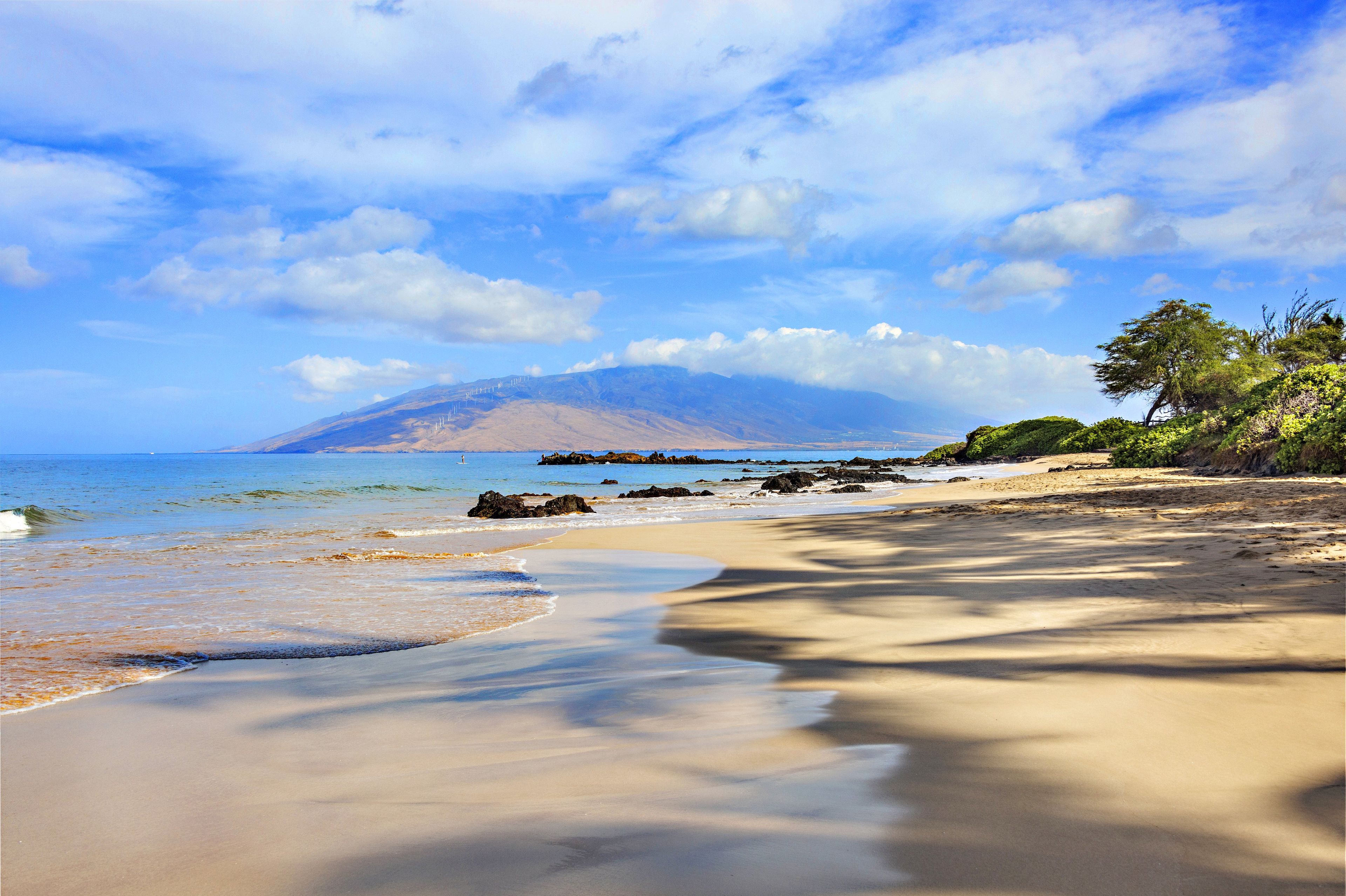 Soft sand and clear water just across the street.