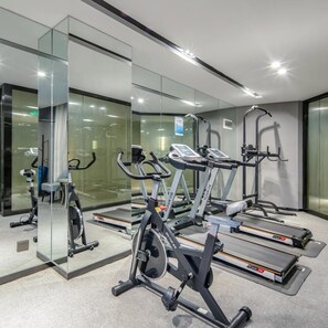 A modern gym with treadmills, elliptical machines, and free weights. - Echarm Hotel Nanning International Convention and Exhibition Center Metro Station (Nanning)