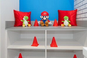 A shelf with plush toys and red cones. - 10251 ET - Paradiso Grande Five-Bedroom Poker Villa (Orlando)