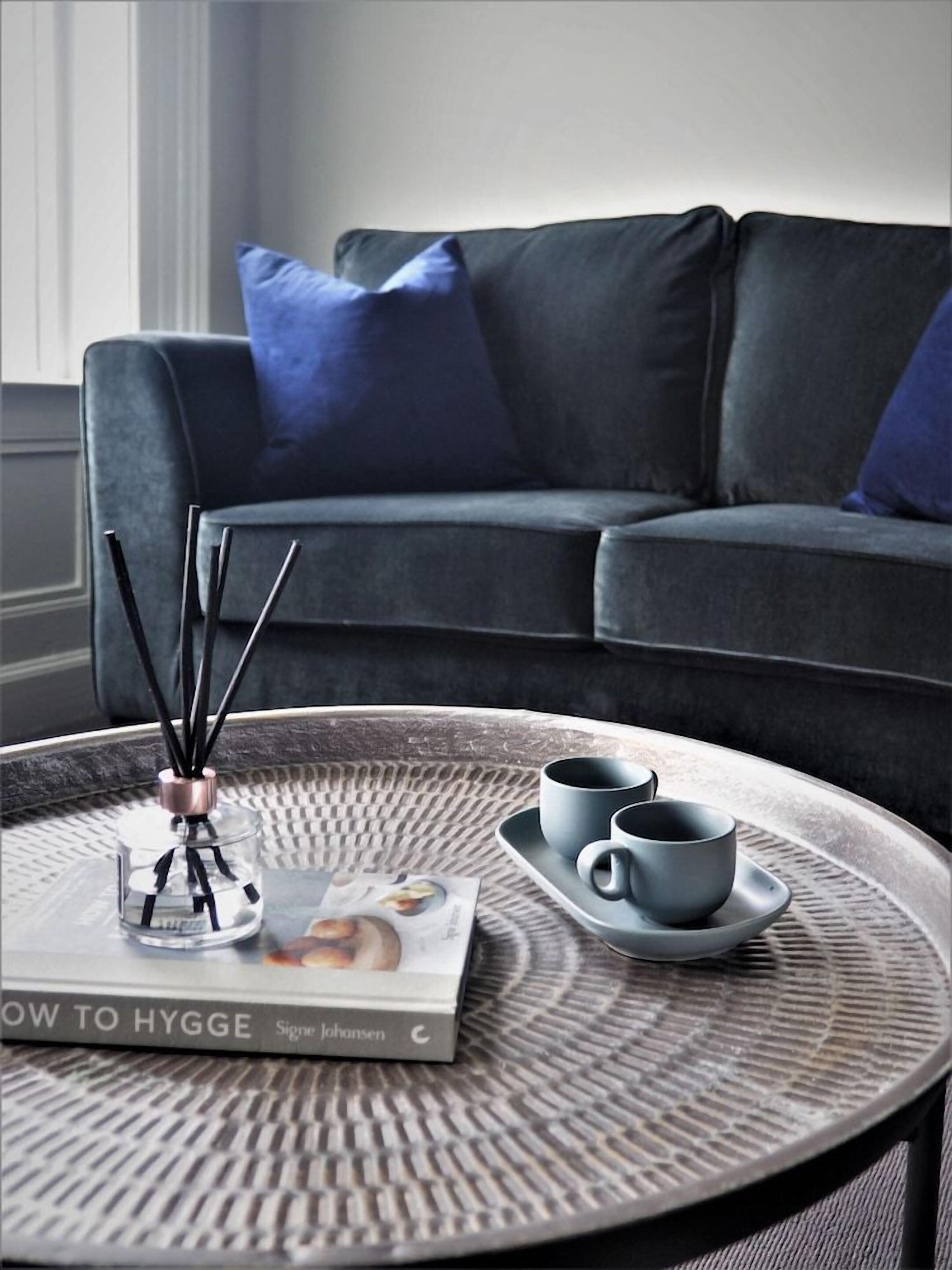 A modern living room with a sofa and a coffee table.