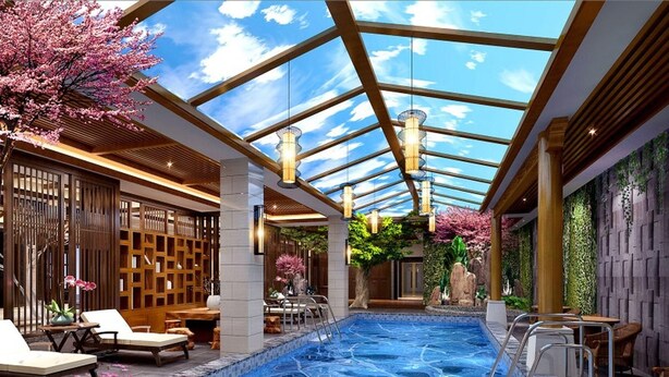 A modern indoor pool with a glass ceiling, wooden furniture, and a view of cherry blossoms. - Greentree Eastern Kunming Baiyun Road Tongde Square Hotel (Kunming)