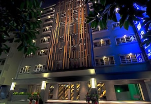 A multi-story hotel with vertical lighting accents and a modern facade. - Royal Guest Hotel (Tainan)