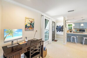 A modern kitchen with a microwave, a sink, and a countertop. - Palm Trees & Manatees (Anna Maria)