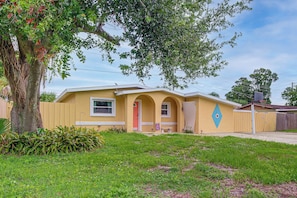 A single-story house with a front porch, a small attached garage, and a fenced yard. - 'Trop Rock Inn' Outdoor Oasis & Music Studio (Melbourne)