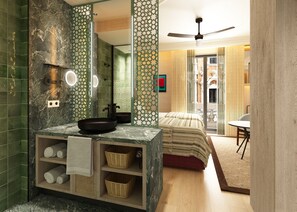 A modern bathroom with a marble sink, a shower, and a large mirror. - Hotel Fenix Sevilla by Vibra - New Opening 2027 (Seville)