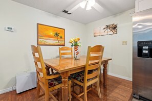 Unclassified image, 5 of 44, button - Escape to a quiet wooded retreat in New Smyrna Beach. This charming 2BR/1BA home features two queen bedrooms, an open kitchen and living area, dining for six, a screened front porch and covered back porch for relaxing and enjoying nature. (New Smyrna Beach)