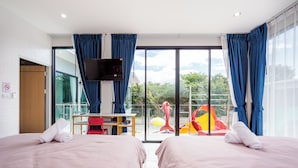 A hotel room with two beds, a desk, a television, and a balcony with a slide. - Love U Pool Villa-Hua Hin (Tambon Hua Hin)