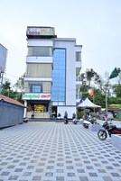 A multi-story building with a restaurant and private lounge on the ground floor.