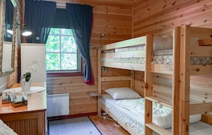 A wooden cabin with bunk beds, a small desk, a mirror, and a window with curtains. - 2 bedroom gorgeous home in årjäng (Årjäng)