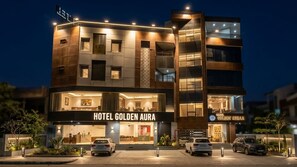 A multi-story hotel with a prominent sign reading 'HOTEL GOLDEN AURA.' - Hotel Golden Aura Inn (Gwalior)