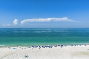A beach with clear skies and calm waters. - Private Beach • 3 Heated Pools • Ground Floor (Siesta Key)