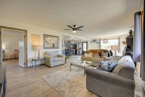 A spacious living room with a ceiling fan, a sofa, a coffee table, and a rug. - Cast, Catch & Relax: Craig Home, Step to River (Wolf Creek)