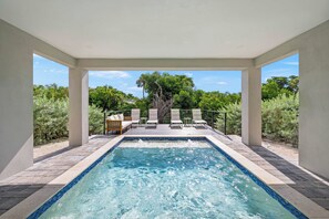 A rectangular pool with clear blue water, surrounded by a tiled deck. - Luxury Pet Friendly Waterfront Home Private Pool & Dock in Resort Community Manatee Dreams at Hunters Point (Cortez)