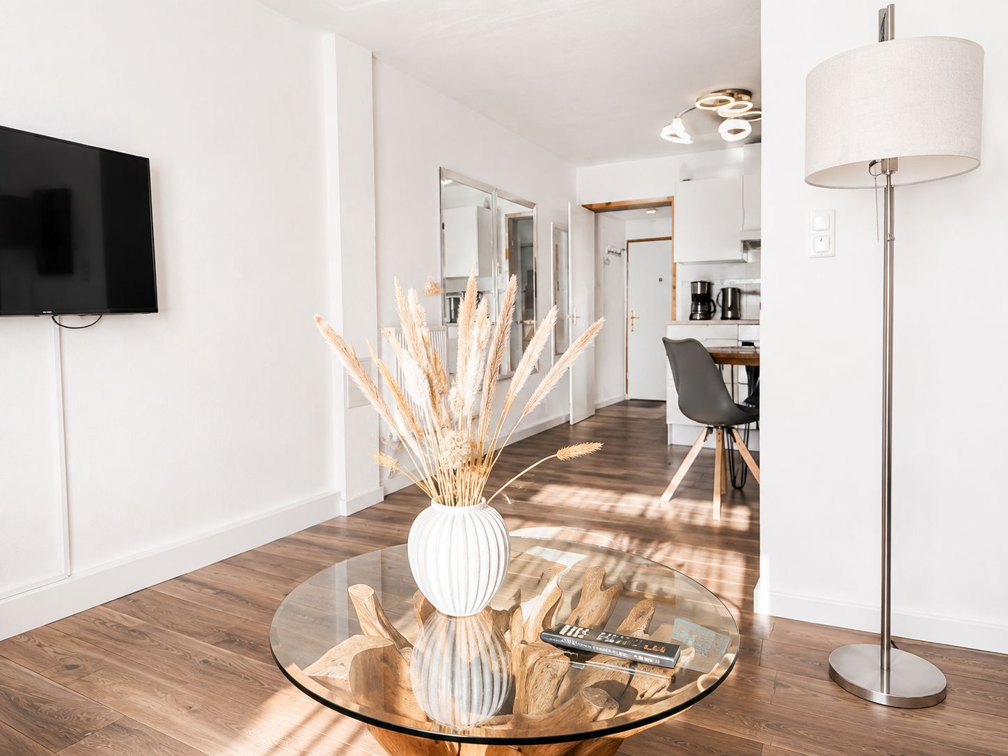 Bright, modern living room with elegant dining area