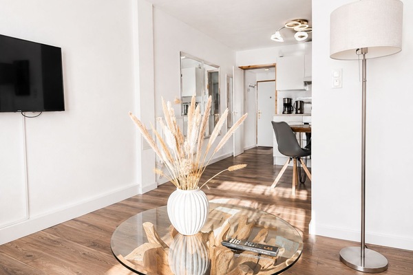 Bright, modern living room with elegant dining area