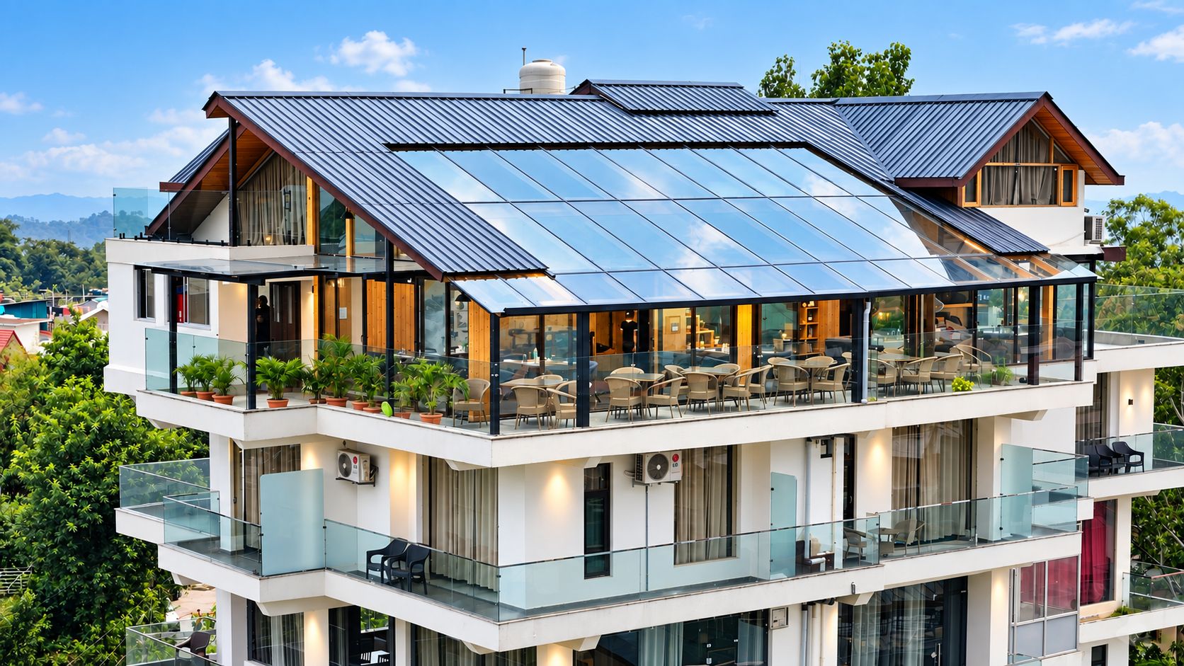 A multi-story building with a rooftop solar panel array, outdoor seating area, and multiple balconies.