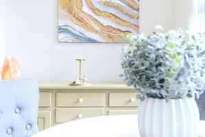 A room with a marble wall art, a white vase with greenery, a salt lamp, and a blue upholstered chair. - Roundhay Retreat – Family-Friendly Home + Parking - Pass the Keys (Leeds)