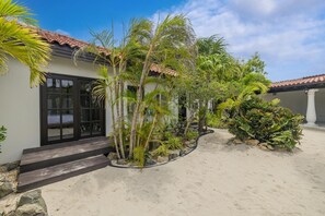 A house with a tiled roof, a front door, and a pathway leading to the entrance. - Opal Luxury Estate | 6BR Villa, Private Pool & BBQ (Noord)