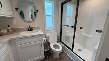 Magnolia | Bathroom | Shower, hair dryer, towels, soap