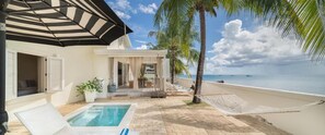 A pool area with a hammock, a covered seating area, and a view of the ocean. - Little Good Harbour House- 3BR Ocean Front Villa (St. Peter)