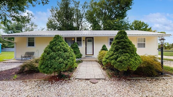 A single-story house with a front porch, a small window, and a door. - The Ocean Rancher - 40 Woodland Ave (Ocean View)