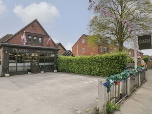 A building named 'Platta' with a sign indicating it is a cafe, bar, and bistro. - The Old Print House (Ilkeston)