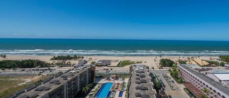 A coastal hotel with a rooftop pool, beach access, and ocean views.
