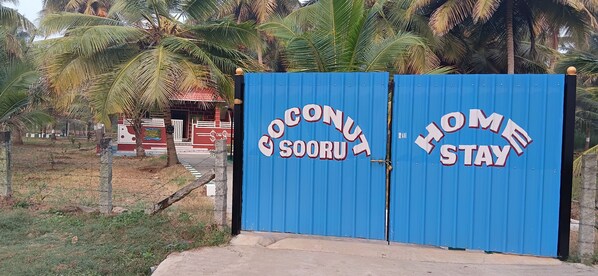A blue gate with 'Coconut Sooru Home Stay' written on it. - Coconut Sooru Homestay Channapatna (Kurnagere)