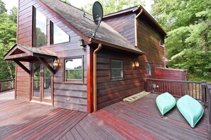 A cabin with a deck, large windows, and a satellite dish. - Work Hard Play Hard- View-Gameroom (Blue Ridge)
