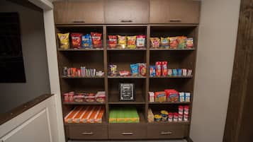 A pantry with various snacks and food items.